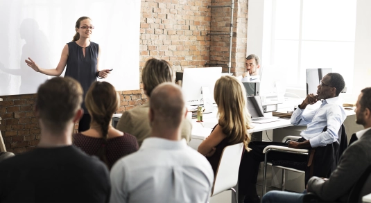 lady delivering crisis communications training to a room of people