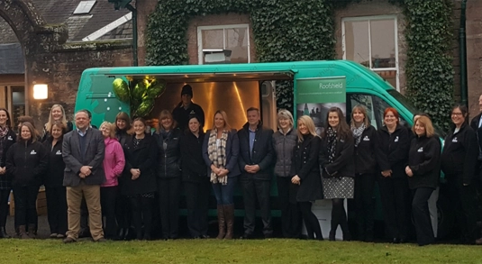 Members of the A.Proctor Group team gather outside their UK tour van
